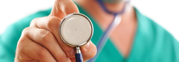 Close-up of a healthcare professional holding a stethoscope